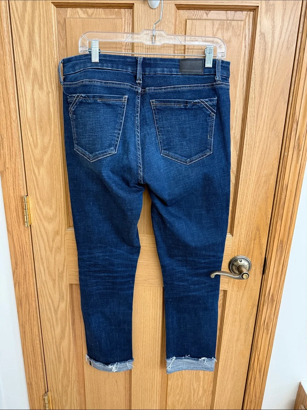 Buckle Black Dark Indigo Denim Jeans with Black Logo Patch